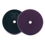 Two foam cutting pads, one black and one purple, on a white background.